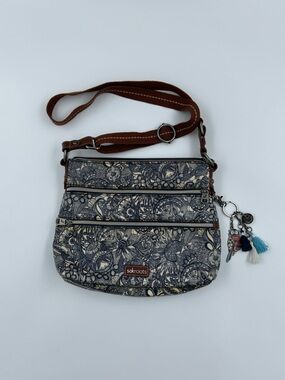 Sakroots Artist Circle Navy and Cream Floral Crossbody with Tassel Charm